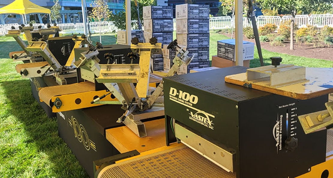 Live Screen Printing vs. Live Heat Pressing: Which On-Site Activation is Right for Your Event?